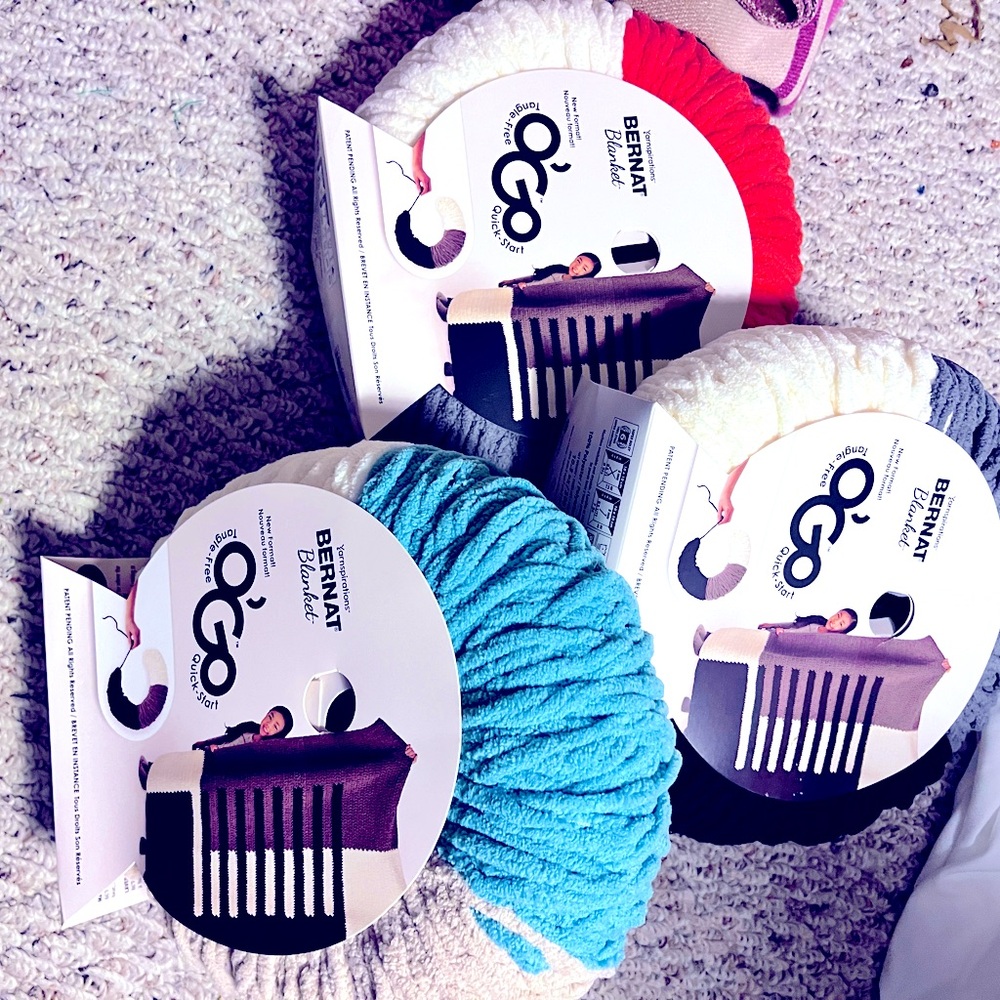 Selling yarns (Bernat) wound to be used to make a coordinating blanket.